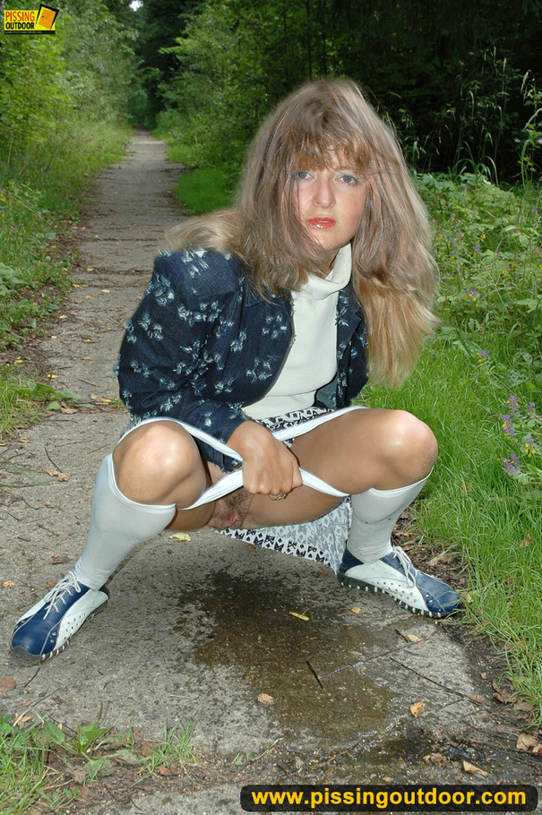 Cute chick in white pants and stockings sprays piss outdoors in park - XXXonXXX - Pic 6