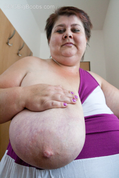 Old fat slut with gigantomastia gets naked - Picture 10