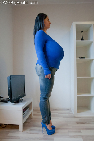 Brunette babe with huge juggs in jeans and blue pullover - Picture 6