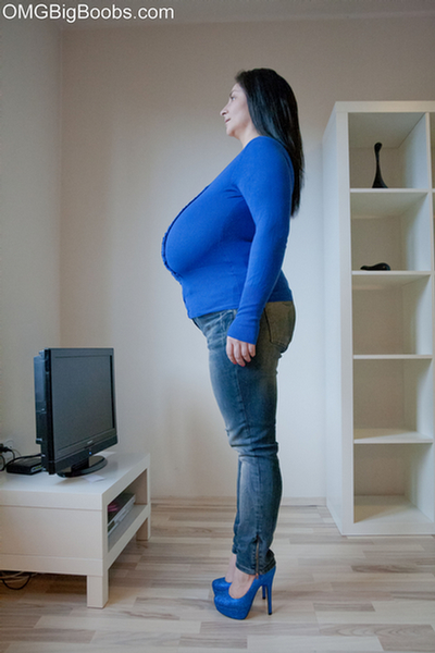 Brunette babe with huge juggs in jeans and blue pullover - Picture 8