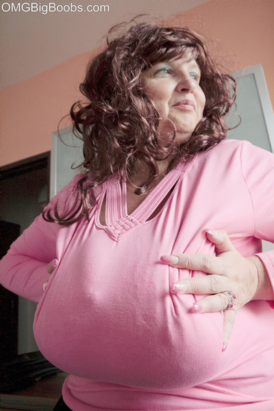 Curly brunette bbw in a pink pullover boasting with her - Picture 4