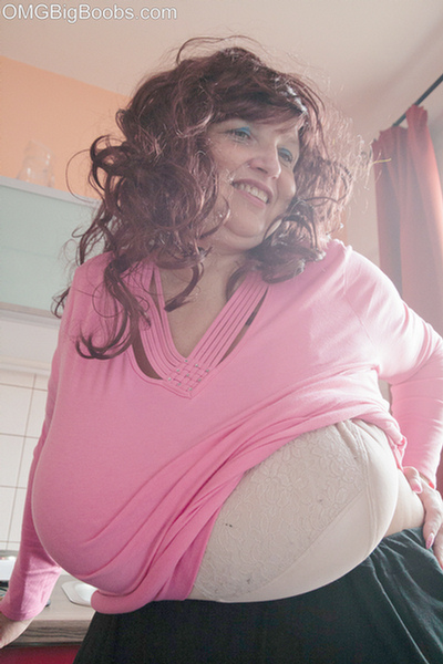 Curly brunette bbw in a pink pullover boasting with her - Picture 7
