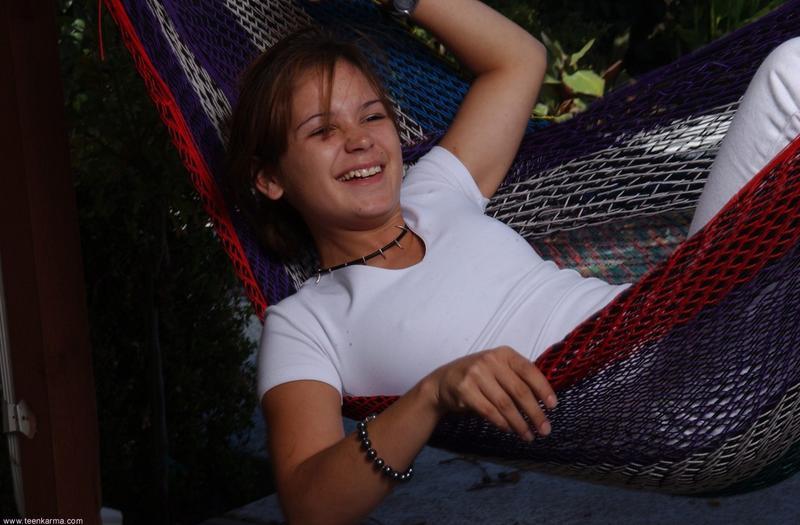 Lovely brunette freshie undresses to pose naked in white socks - XXXonXXX - Pic 1