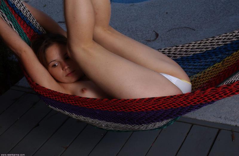 Lovely brunette freshie undresses to pose naked in white socks - XXXonXXX - Pic 10