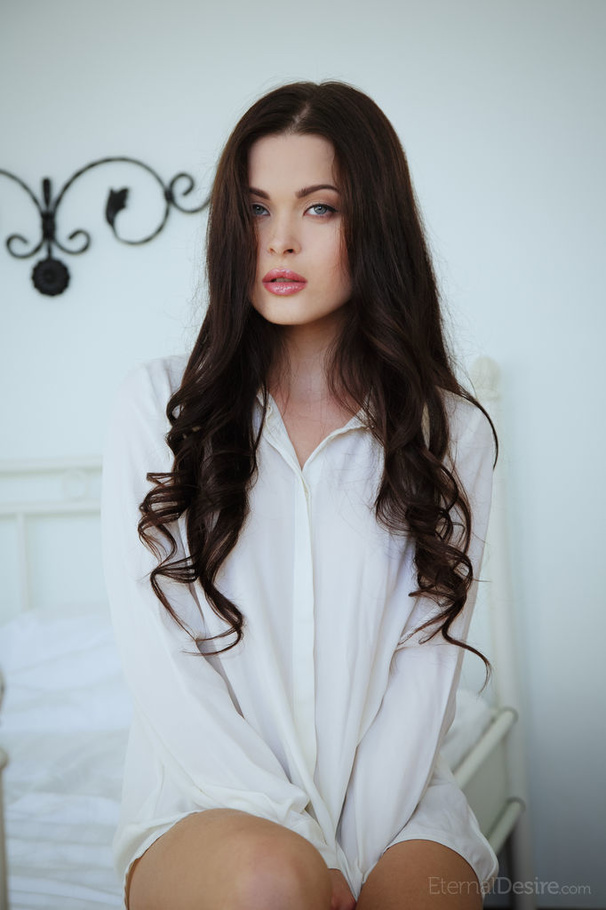 Tender brunette girl in a white shirt posin - XXX Dessert - Picture 1