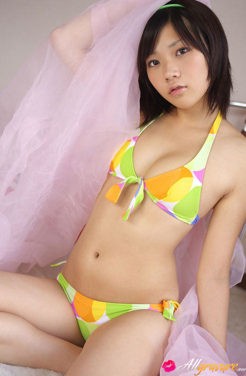 Broad models on a furry white rug in her bikini. - XXXonXXX - Pic 13