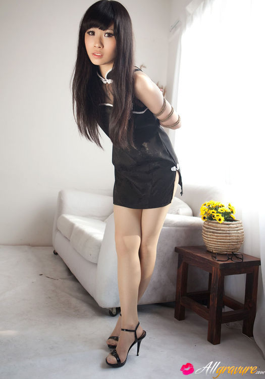 Tart in a black dress and heels poses bound on the sofa. - XXXonXXX - Pic 1