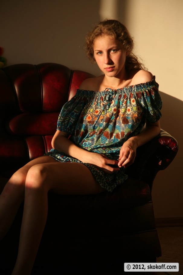 First-rate nymph in a blue patterned dress flashes her goodies on a chair. - XXXonXXX - Pic 1