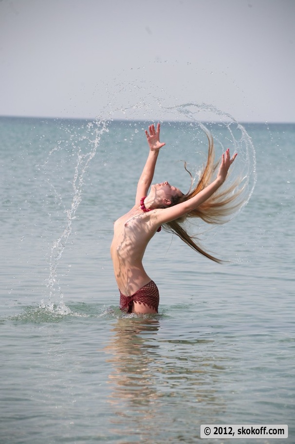 Fascinating vamp with a fishnet wrap playing nude in the water. - XXXonXXX - Pic 5