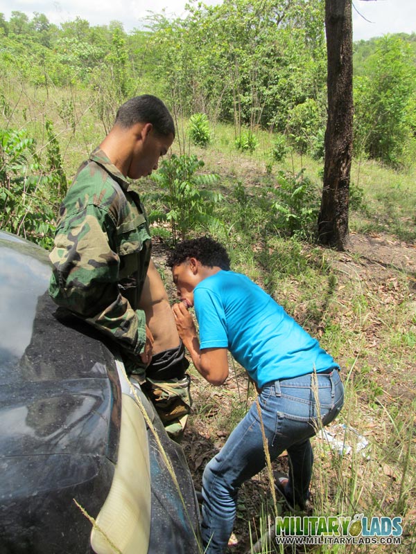 Male in camo gear gets his cock sucked in front of a car. - XXXonXXX - Pic 4