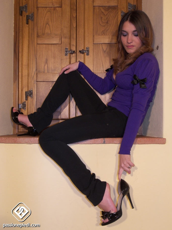 Gal in black open toe heels exposes her naked feet by a window. - XXXonXXX - Pic 3