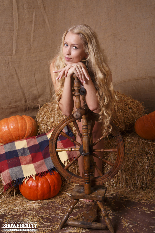 Beaver in a colorful dress posing on some hay in the studio. - XXXonXXX - Pic 11