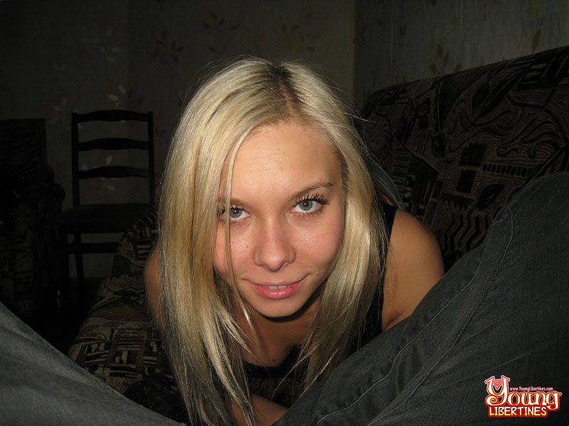 Golden-haired hottie in black tank and jean skirt joyfully rides stiff prick on plush sofa. - XXXonXXX - Pic 5