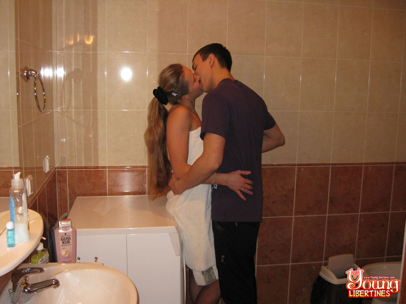 Long-haired blonde doing laundry in a towel breaks to fuck, steadying herself on sink and dryer. - XXXonXXX - Pic 3
