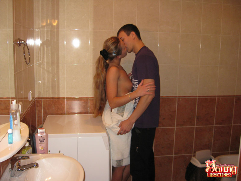 Long-haired blonde doing laundry in a towel breaks to fuck, steadying herself on sink and dryer. - XXXonXXX - Pic 4