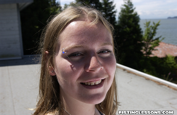 Mischievous minx poses provocatively on a rooftop then takes it inside to finger her ass. - XXXonXXX - Pic 1