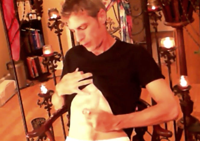 Mature dude draws circles on his body before he takes off his black shirt and black and red brief then he grabs his dick then jacks off on a brown chair. - XXXonXXX - Pic 1
