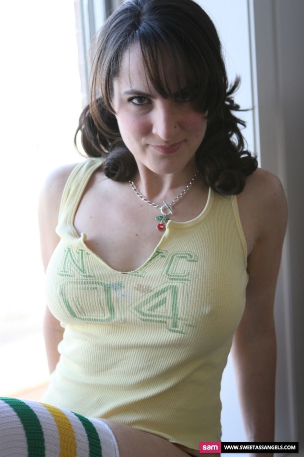 Gorgeous babe takes off her yellow shirt and displays her sweet tits wearing her black thong and white socks with green and yellow stripes by the window. - XXXonXXX - Pic 5