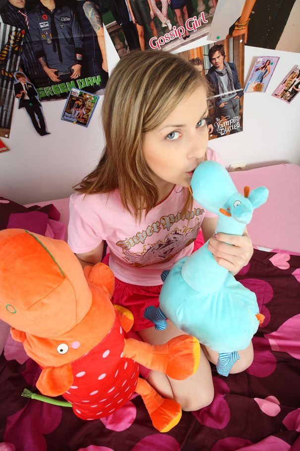 Teen blonde in pink shirt, skirt and socks loves to seduce as she seductively eats her strawberries before she takes off her shirt and expose her petite boobs on a pink bed. - XXXonXXX - Pic 11