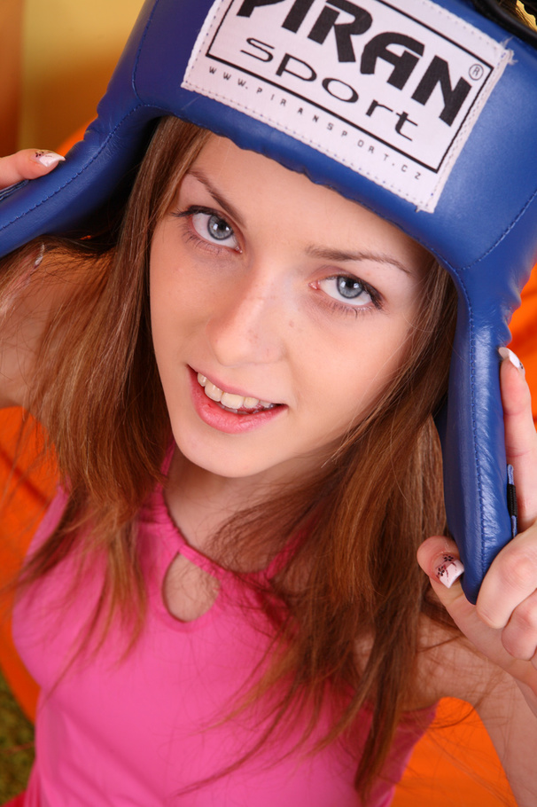 Smoking young babe with perfect curves wearing her blue head gear, black boxing gloves, pink shirt and leggings takes them off piece by piece then seduces with her indulging body with luscious tits and pussy as she lays naked on a green carpet. - XXXonXXX - Pic 5