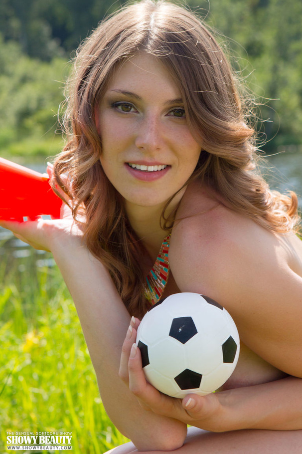 Gorgeous hottie goes out on a grassy field by a lake and seduces with her foxy body as she slowly strips off her blue floral dress and teases with her small tits before she takes off her white, purple and yellow panty and shows her hot crack in different poses. - XXXonXXX - Pic 20