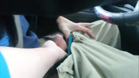 Tattooed brunette slut gives a nasty footjob in the car - Picture 2