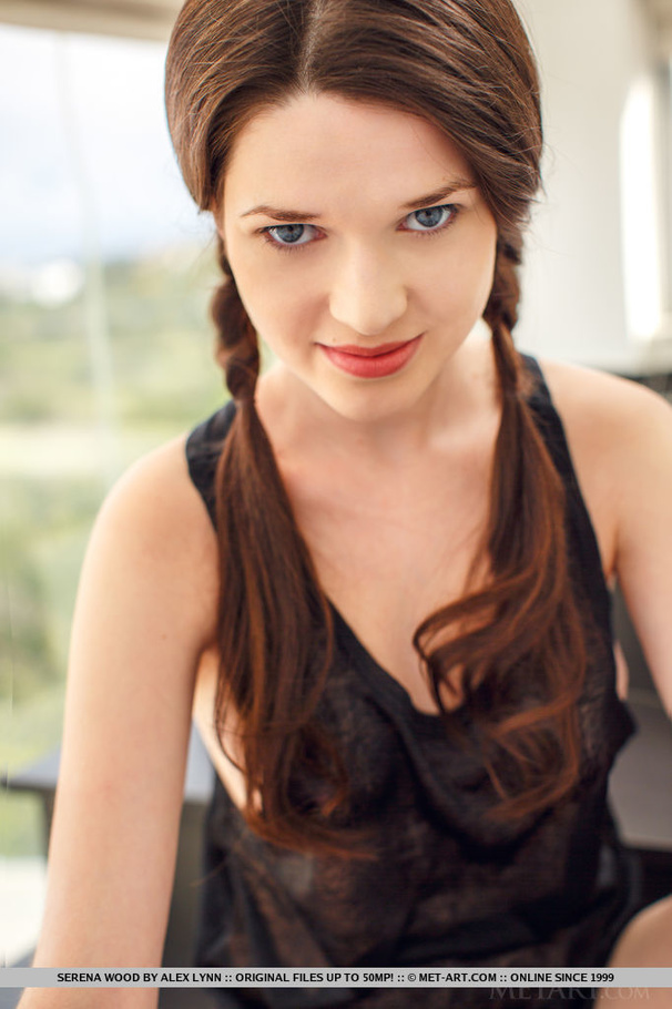 Cute brunette in pigtails sits on a black s - XXX Dessert - Picture 2