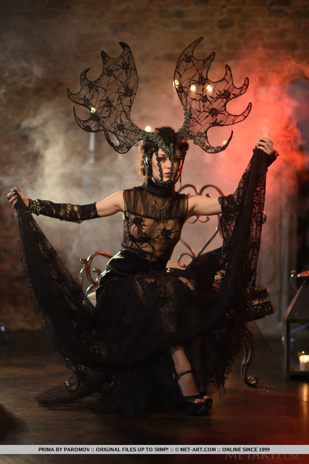 Sizzling hot brunette sits on a gray and bl - XXX Dessert - Picture 2