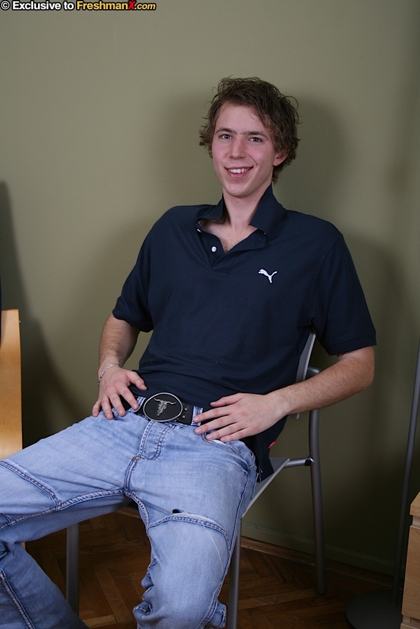 Cute dude takes off his blue shirt and shows his skinny body before he peels down his jeans and white brief and reveals his uncirumcised dick on a blue and brown chair. - XXXonXXX - Pic 1