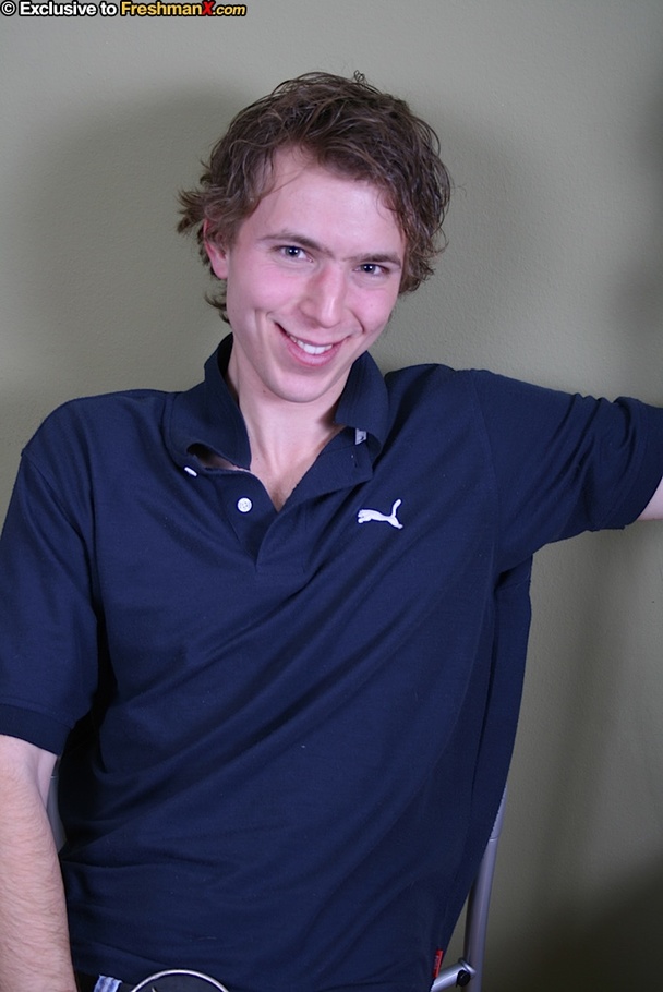 Cute dude takes off his blue shirt and shows his skinny body before he peels down his jeans and white brief and reveals his uncirumcised dick on a blue and brown chair. - XXXonXXX - Pic 2