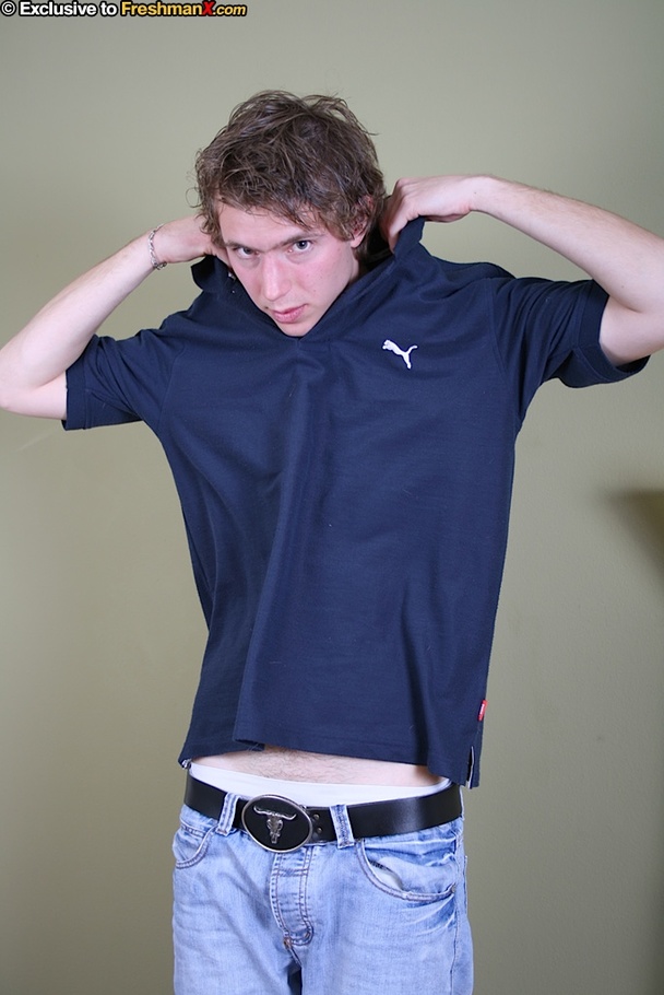 Cute dude takes off his blue shirt and shows his skinny body before he peels down his jeans and white brief and reveals his uncirumcised dick on a blue and brown chair. - XXXonXXX - Pic 4