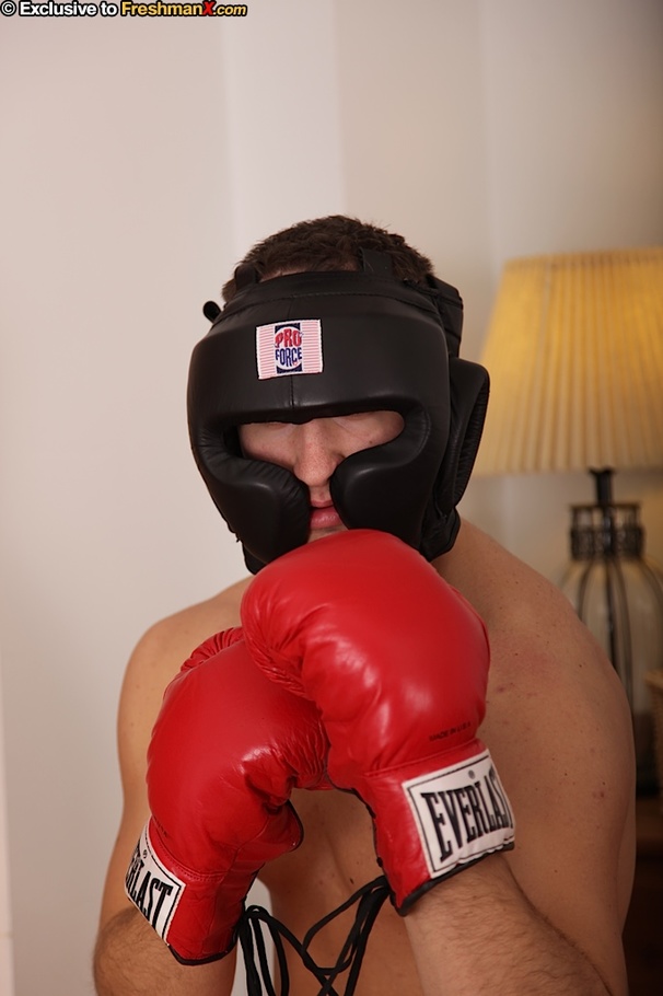 Hunk boxer displays his stunning body wearing his black head gear, red gloves, shorts and white supporter then gets naked and jacks off in his bedroom. - XXXonXXX - Pic 1
