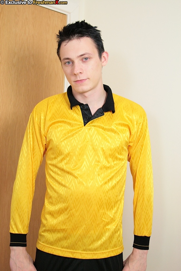 Handsome football star slowly strips off his yellow shirt and black shorts then displays his skinny body before he pulls his big dick out of his white supporter and jacks it on a white bed. - XXXonXXX - Pic 1