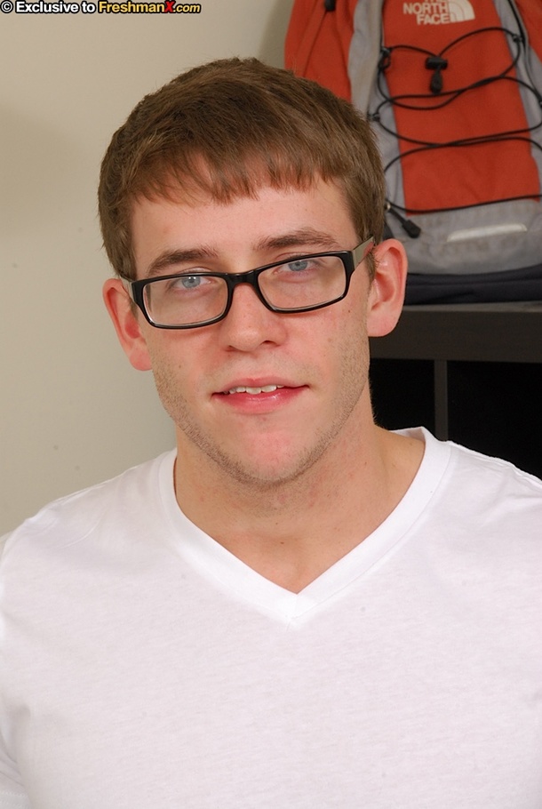 Nerdy dude strips off his white shirt and teases with his stone hard body with tattoos before he lays down on a multi-colored bed and pulls his big schlong out of his jeans. - XXXonXXX - Pic 2