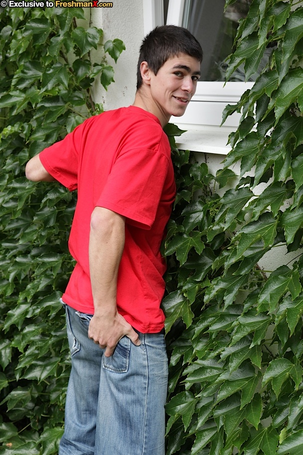 Foxy dude pulls up his red shirt and teases with his muscular body as he sits topless on a wooden chair before he peels down his jeans and yellow boxers and jacks his huge cock in a backyard. - XXXonXXX - Pic 2