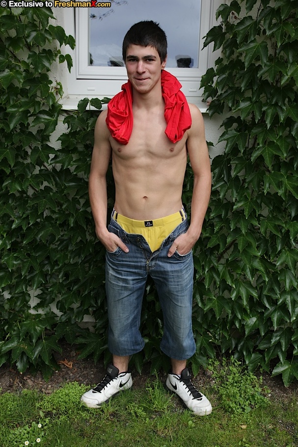 Foxy dude pulls up his red shirt and teases with his muscular body as he sits topless on a wooden chair before he peels down his jeans and yellow boxers and jacks his huge cock in a backyard. - XXXonXXX - Pic 6