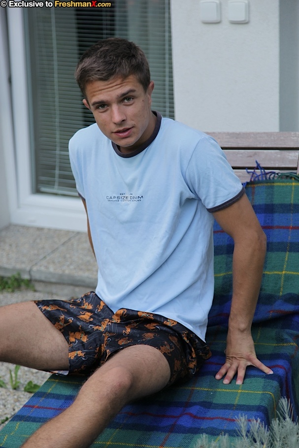 Gorgeous dude takes off his blue shirt and reveals his hunk body outdoor before he pulls down his blue and orange shorts and expose his butt crack and big cock on a green and blue beach bed. - XXXonXXX - Pic 2