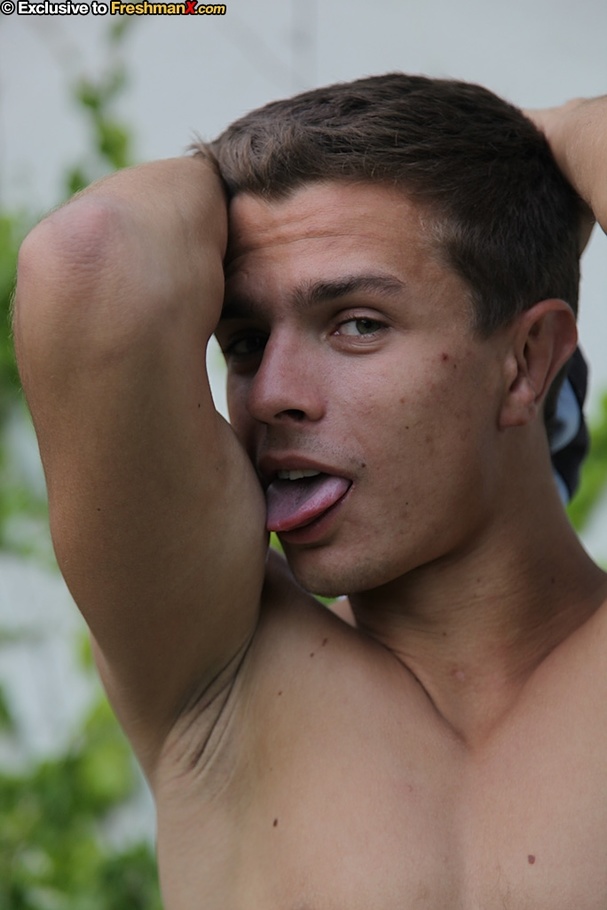 Gorgeous dude takes off his blue shirt and reveals his hunk body outdoor before he pulls down his blue and orange shorts and expose his butt crack and big cock on a green and blue beach bed. - XXXonXXX - Pic 7