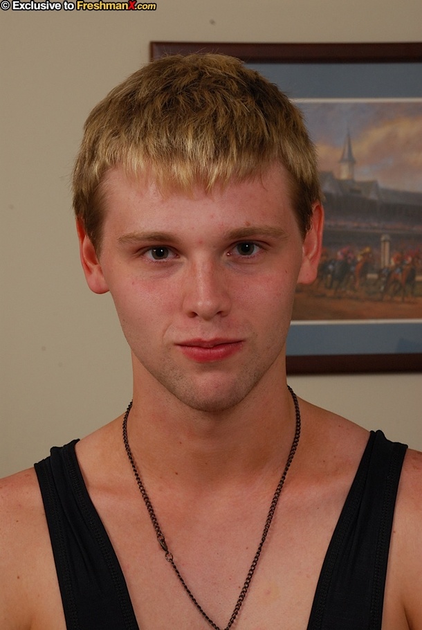 Blonde twink pulls his big dick out of his black and blue spandex before he strips it off and displays his skinny body then removes his white boxers and pose naked on a brown couch. - XXXonXXX - Pic 1