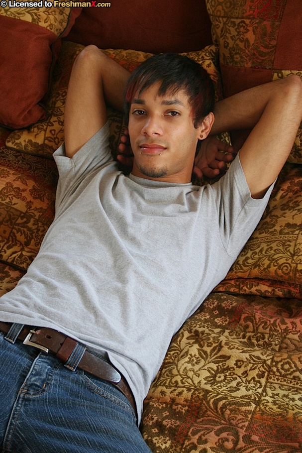 Hunk stud lays down on a multi-colored bed then removes his gray shirt and expose his hard body before he peels down his jeans and maroon boxers then reveals his huge dick. - XXXonXXX - Pic 1