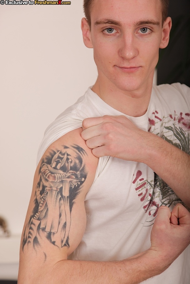 Tattooed dude takes off his white shirt and bares his muscular body before he peels down his jeans and black brief and expose his asshole and big dick on a black couch. - XXXonXXX - Pic 2