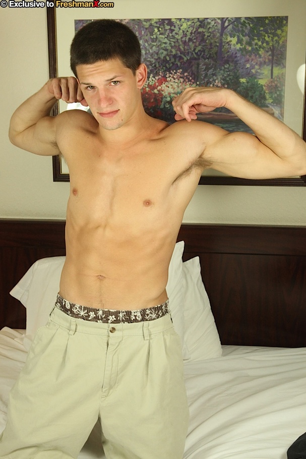 Handsome stud takes off his black shirt and shows his hunk body before he peels off his gray shorts and brown and white boxers then jacks his dick hard on a white bed. - XXXonXXX - Pic 4