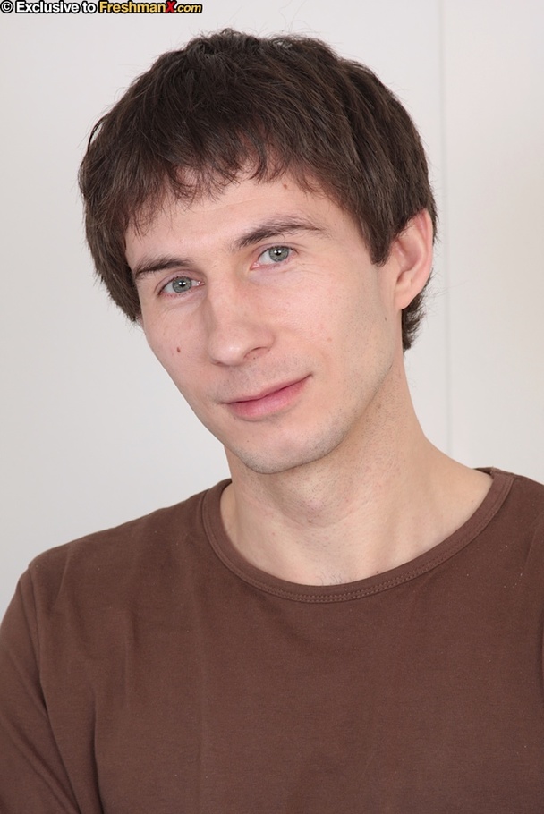 Horny guy in brown shirt and jeans shows his skinny hairy body before he gets naked and wanks his cock on a gray couch. - XXXonXXX - Pic 1