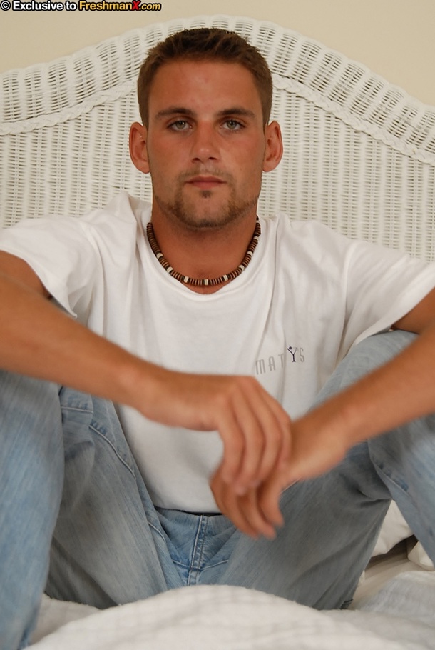 Hot stud takes off his white shirt and shows his skinny body before he takes off his jeans then pulls his dick out of his blue boxers and jacks off as he lays down on a white bed. - XXXonXXX - Pic 3