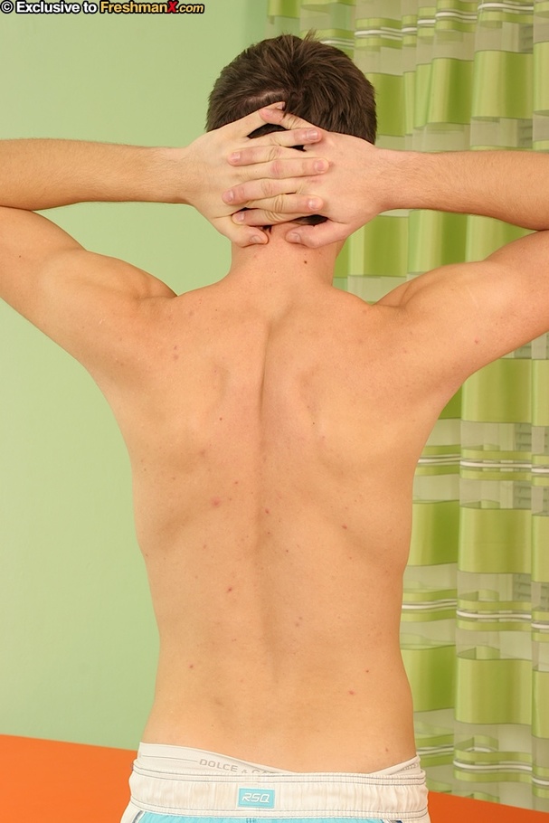 Cute gay removes his gray shirt and expose his hunk body before he pulls down his white shirt and boxers and reveals his hairy asshole and big cock on an orange massage bed. - XXXonXXX - Pic 2