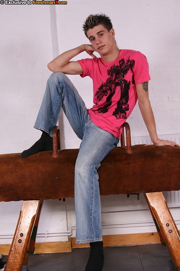 Cute dude in pink and black shirt and jeans slowly takes them off and shows his skinny hard body before he pulls down his pink and gray boxers and shows his large cock as he sits naked on a brown pommel horse. - XXXonXXX - Pic 1