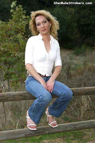 Blonde tranny in a sexy red skirt shows off - XXX Dessert - Picture 1