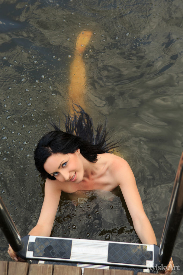 Sexy brunette poses nude by the lake on doc - XXX Dessert - Picture 8