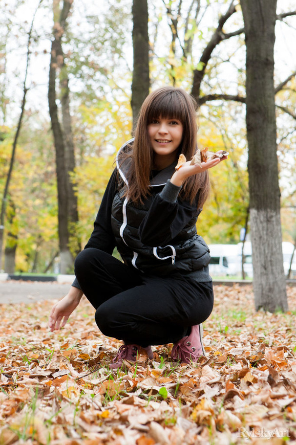 Sexy brunette poses outdoors in coat and un - XXX Dessert - Picture 1