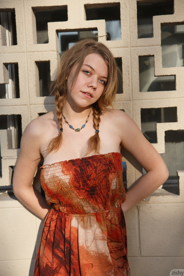 Busty pigtailed teen lifts her orange dress - XXX Dessert - Picture 1